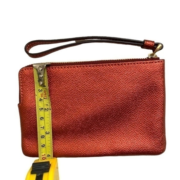 Coach red metallic wristlet bag